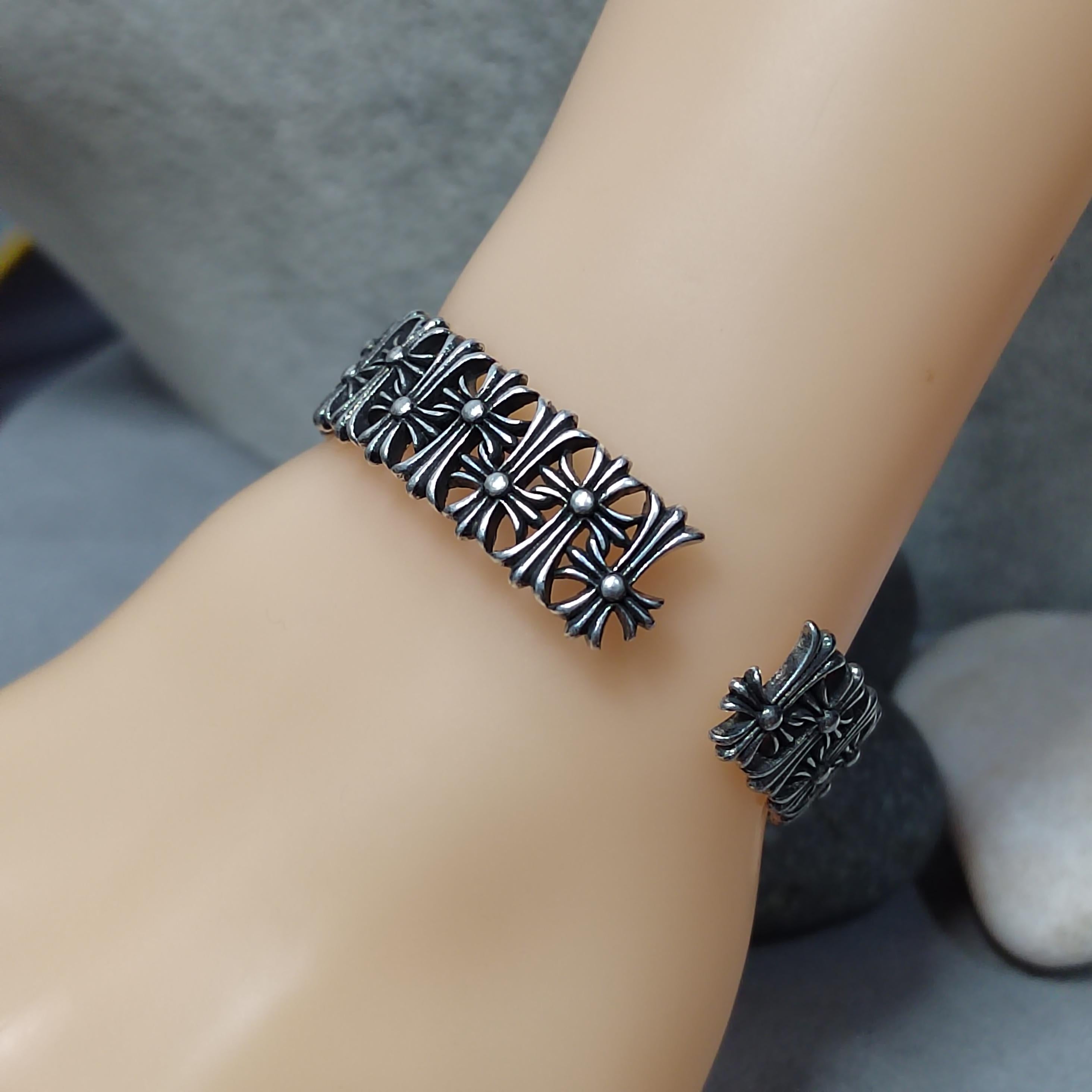 Silver anklets on a person's ankle against a neutral background