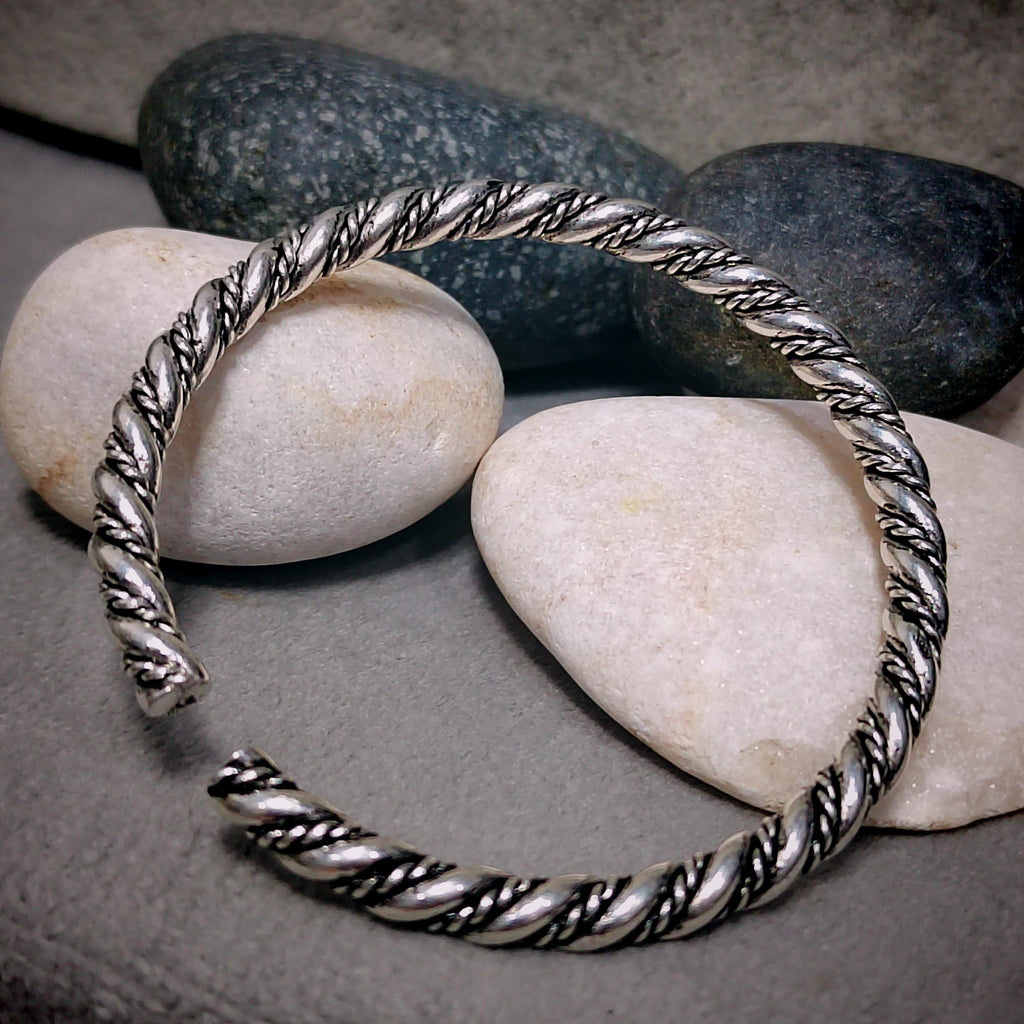 Silver bracelet on pebbles