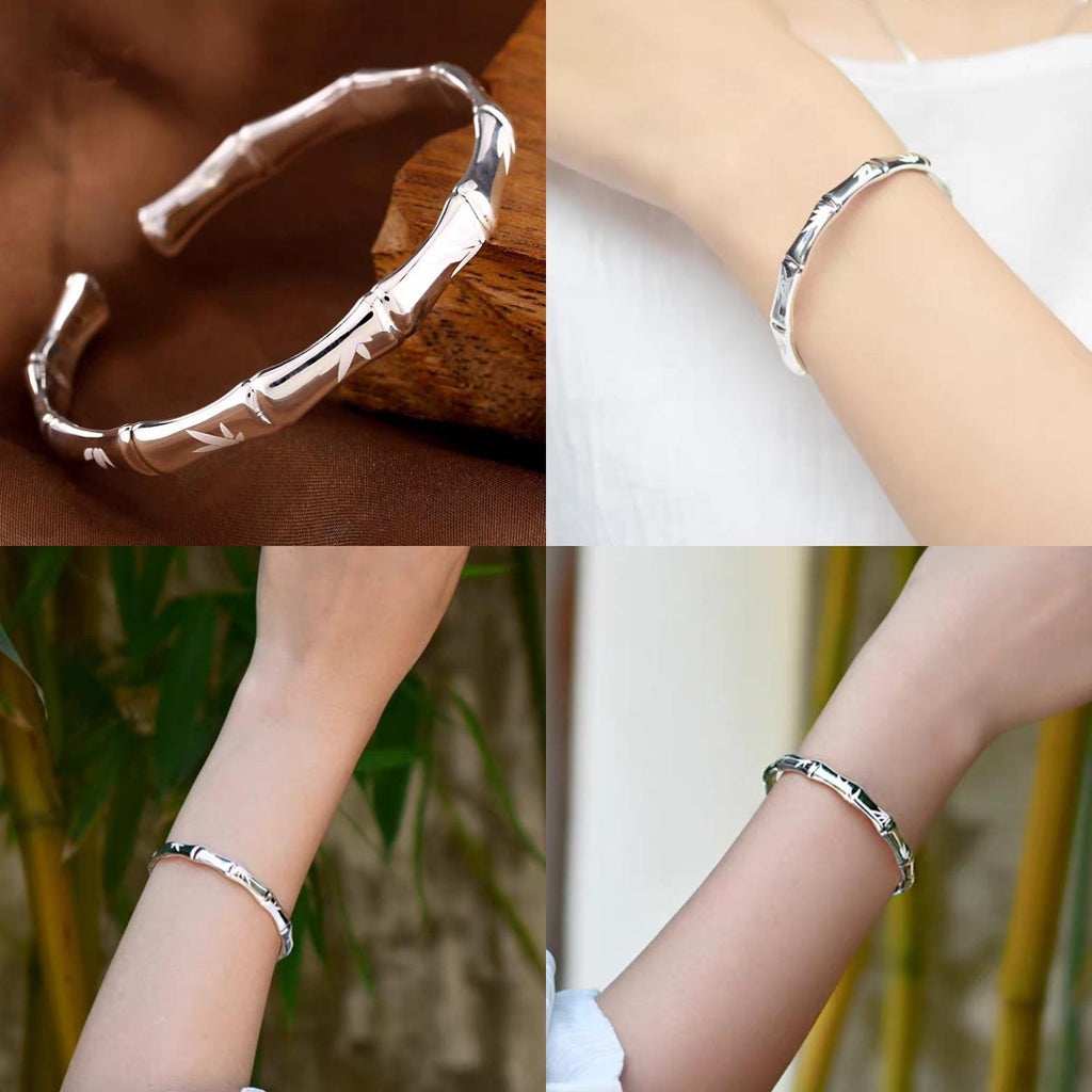 Silver bracelet on a wrist with a bamboo design, displayed against a natural background.