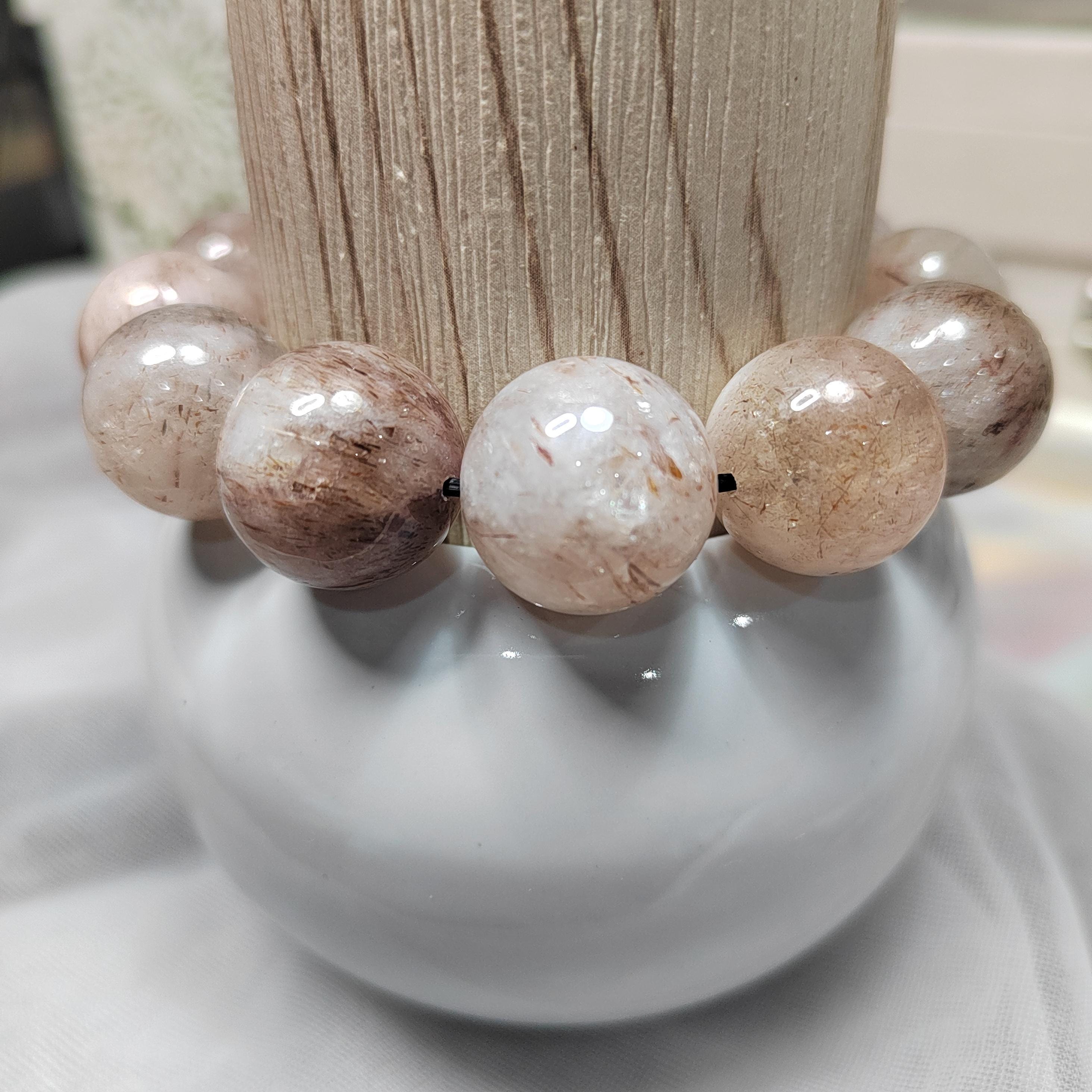 Beaded bracelet with natural stone beads on a white surface
