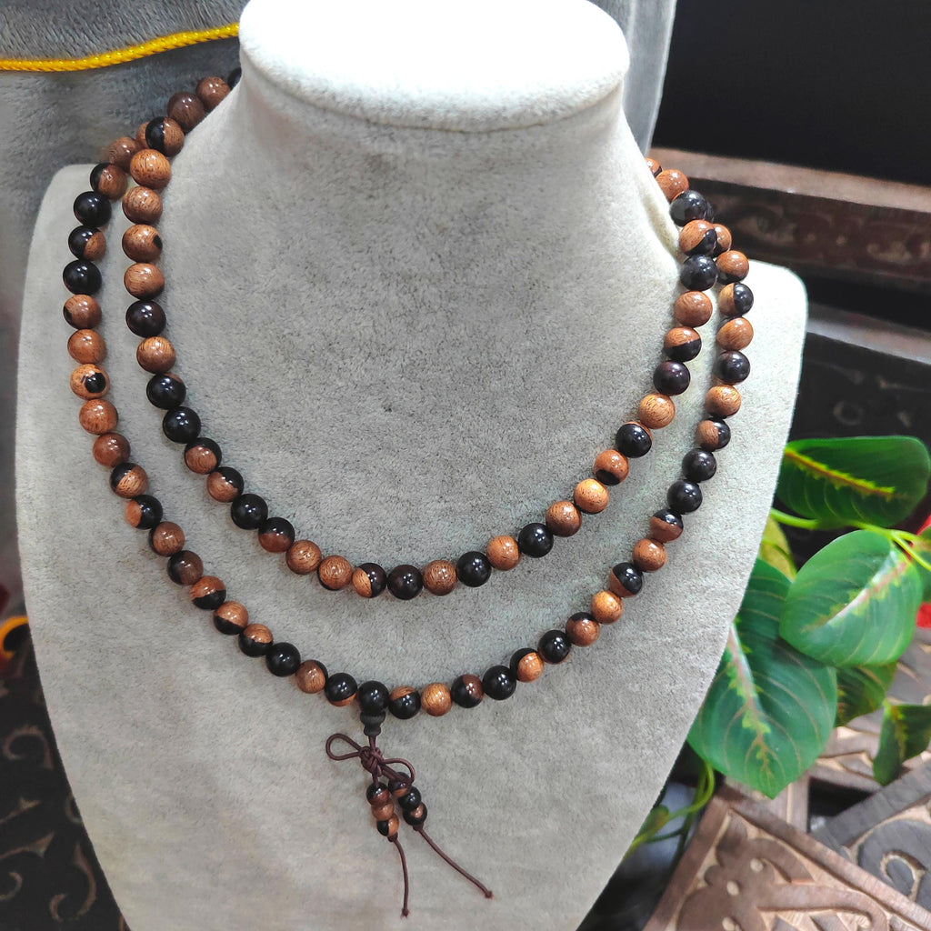 Beaded necklace on a mannequin bust with a blurred background