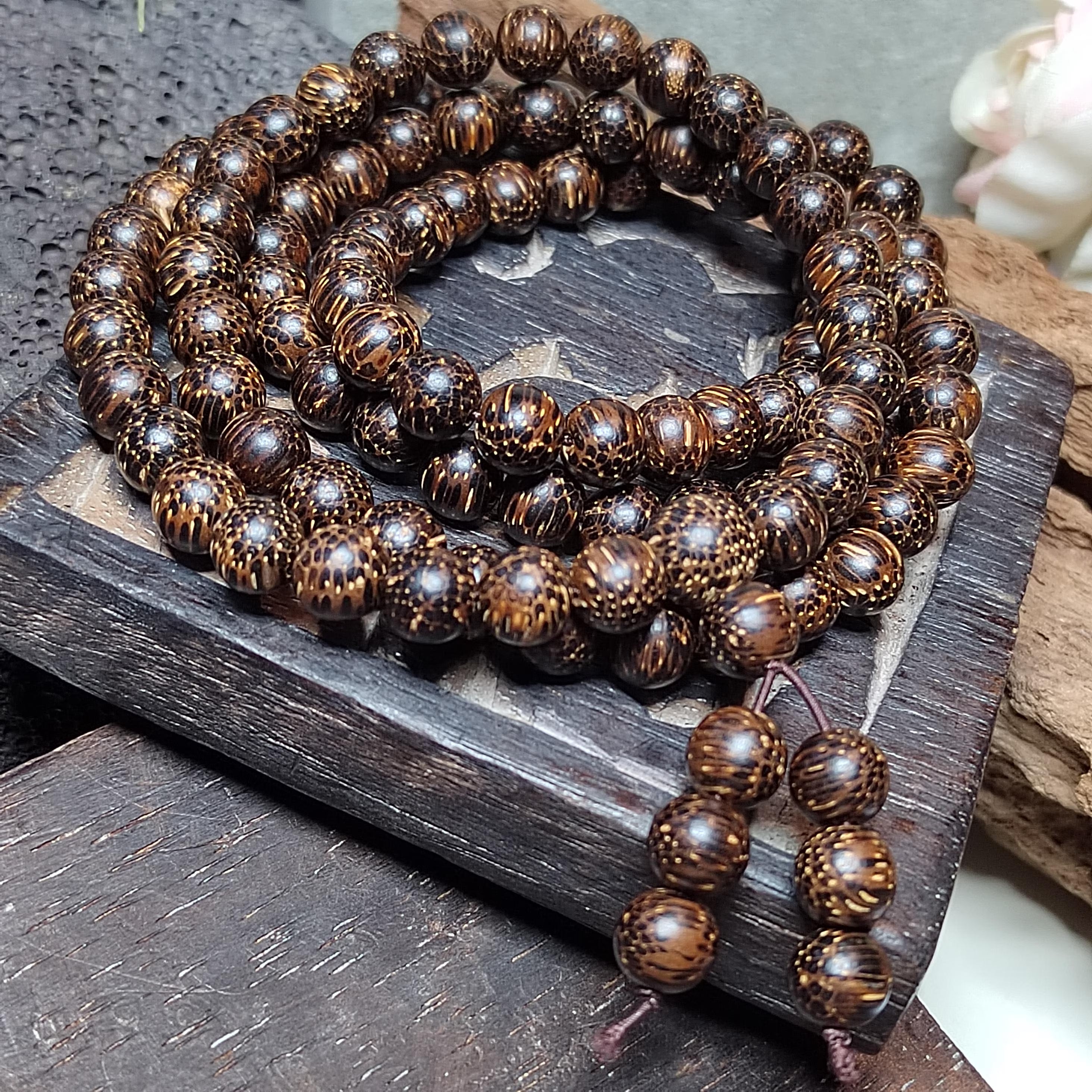 Wooden beaded bracelet on a wooden surface