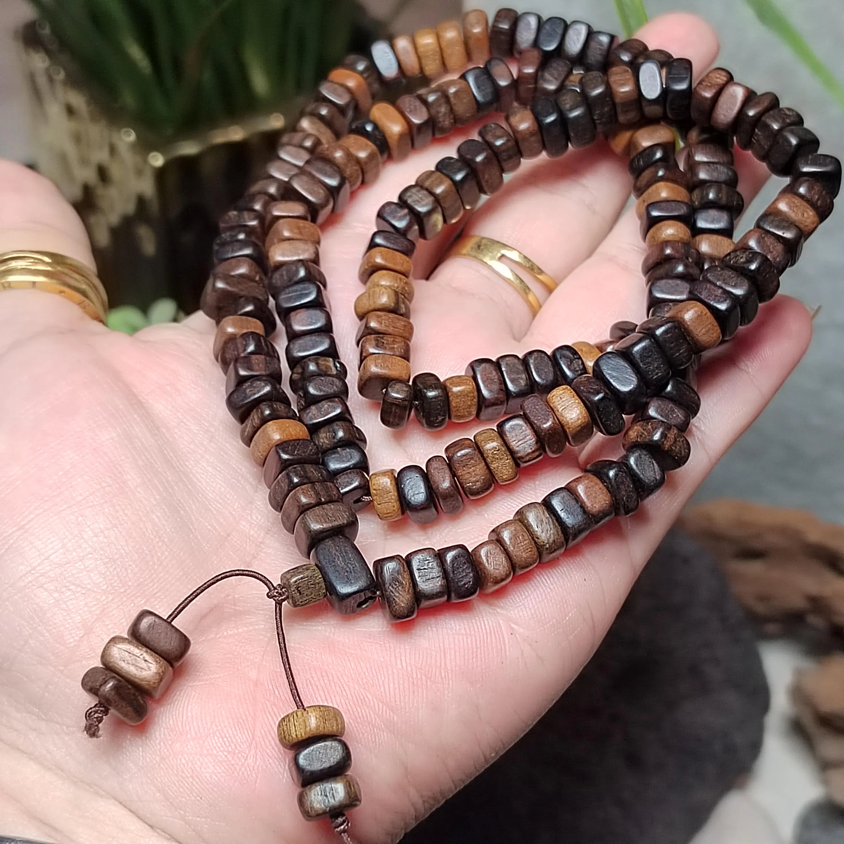Beaded bracelet on a hand with a blurred background