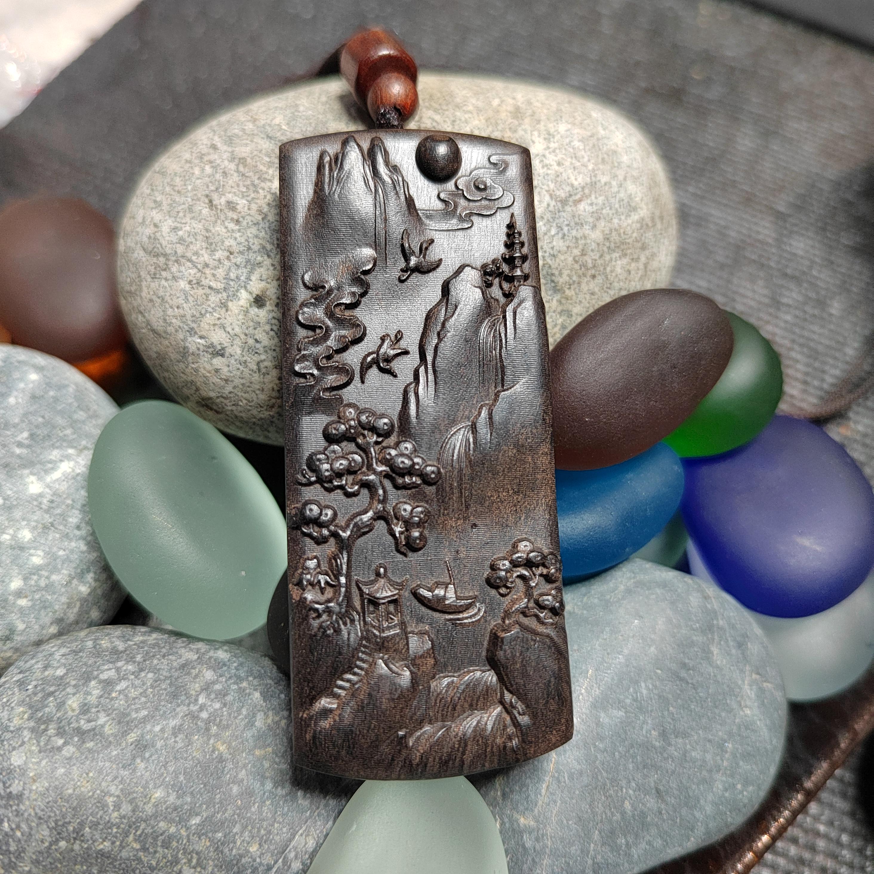 Decorative pendant with nature scene on pebbles