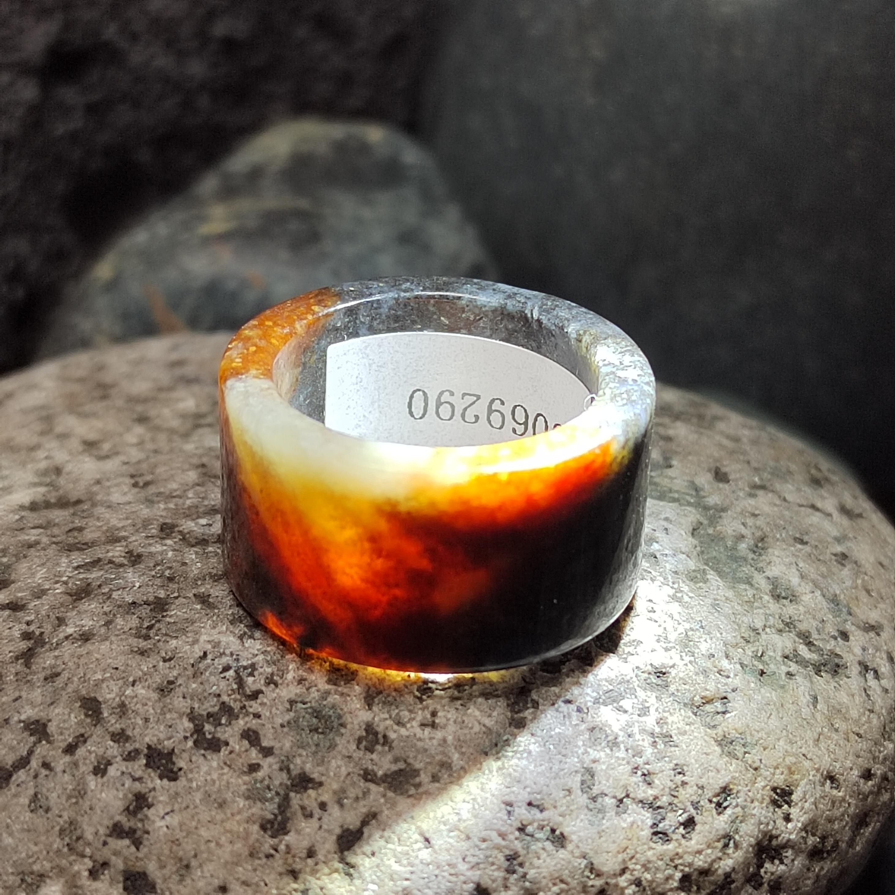 Ring with a gradient design on a stone surface